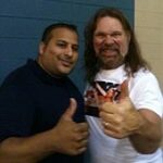 "Hacksaw" Duggan (right) poses with a fan at an independent show in 2013