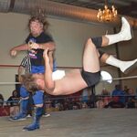 Duggan performing a clothsline