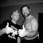 Duggan (right) posing with a fan
